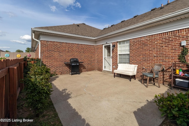 view of patio featuring fence and grilling area