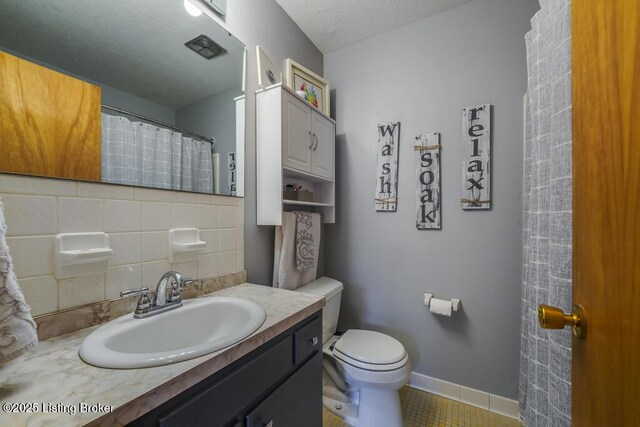 full bath featuring toilet, decorative backsplash, tile patterned flooring, and vanity