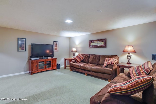 living room featuring baseboards and carpet flooring