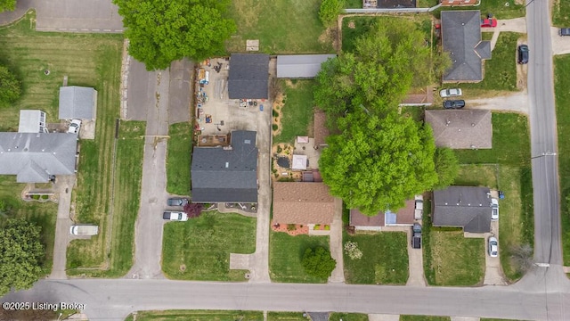 birds eye view of property with a residential view