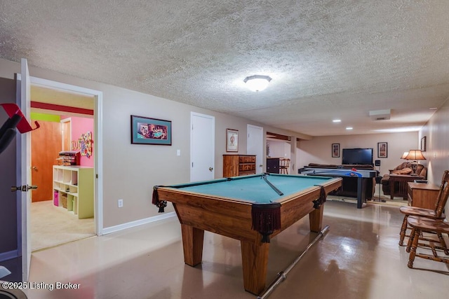 recreation room featuring billiards and a textured ceiling