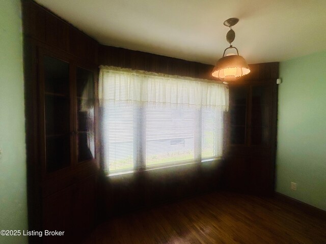 spare room featuring wood finished floors