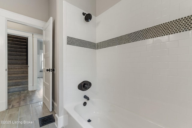 bathroom with shower / washtub combination