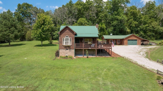 515 Brier Creek Meadows Rd, Mammoth Cave, KY 42259 - view of front facade with a wooden deck, driveway, a chimney, and a front yard