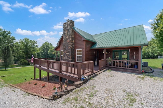 515 Brier Creek Meadows Rd, Mammoth Cave, KY 42259 - chalet / cabin with a front yard, central air condition unit, a chimney, and metal roof