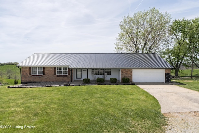 single story home featuring a garage, a front lawn, brick siding, metal roof, and driveway