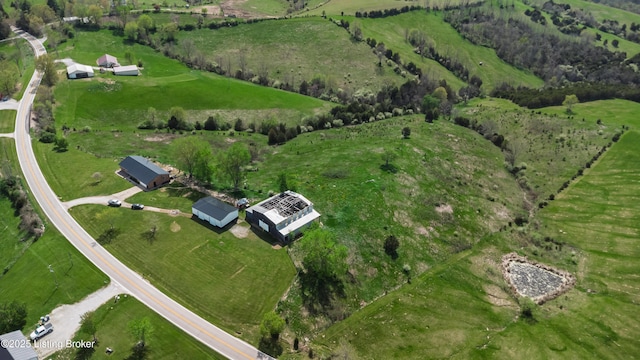 birds eye view of property featuring a rural view