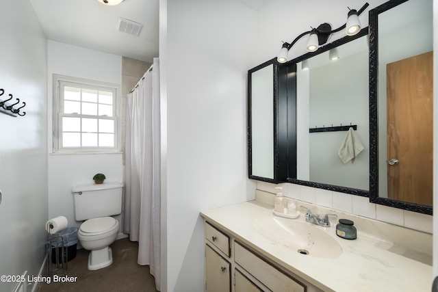 full bathroom featuring vanity, toilet, and visible vents