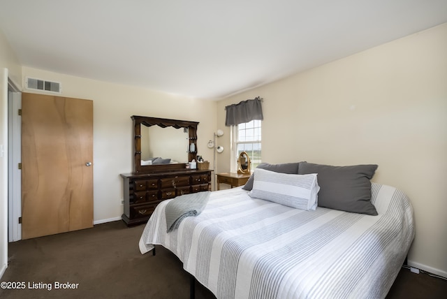 carpeted bedroom featuring visible vents