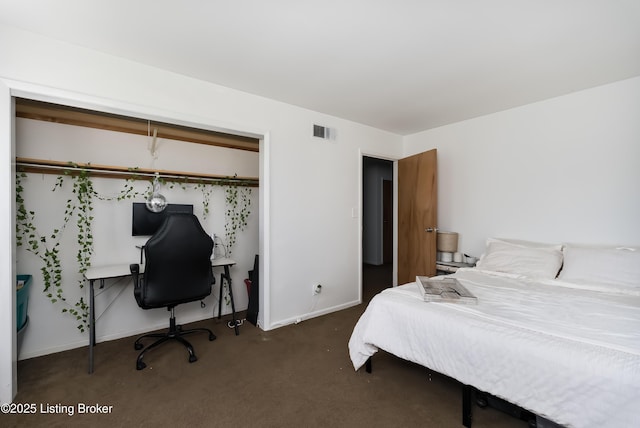 carpeted bedroom with visible vents and baseboards