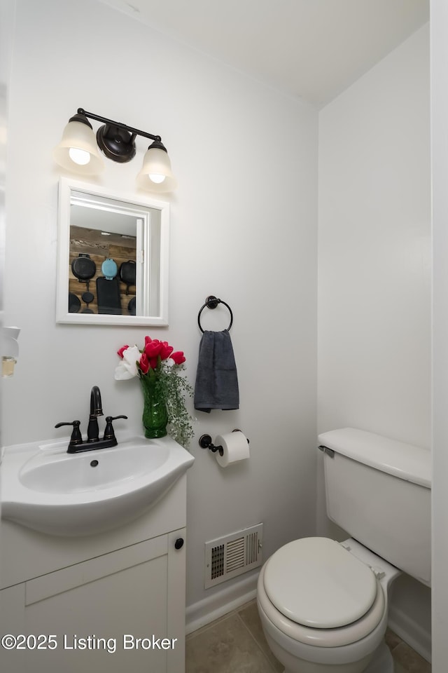 half bathroom featuring visible vents, tile patterned flooring, toilet, and vanity