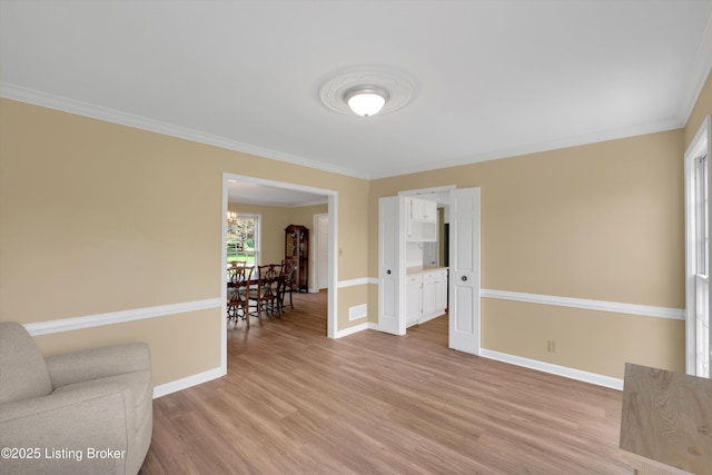 living room with baseboards and light wood finished floors