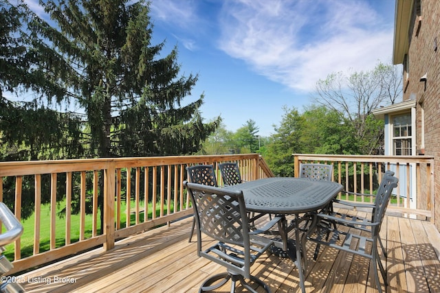 deck with outdoor dining area