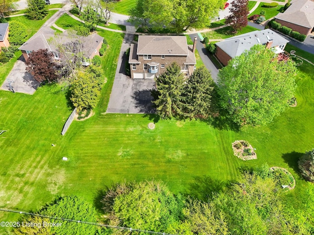 birds eye view of property with a residential view