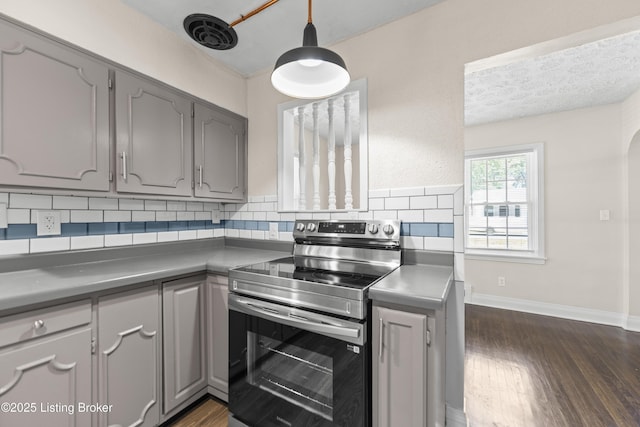4926 Forest Park Dr, Louisville, KY 40219 - kitchen featuring stainless steel electric range, gray cabinets, dark wood-type flooring, tasteful backsplash, and baseboards