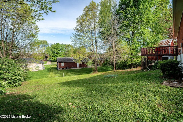 view of yard featuring a wooden deck