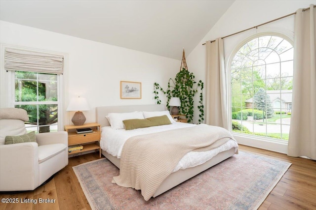 bedroom featuring vaulted ceiling and wood finished floors