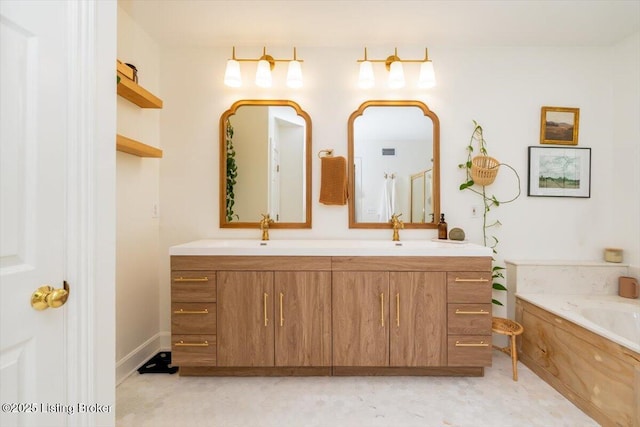 bathroom with double vanity, a garden tub, and a sink