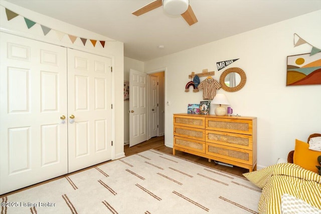 bedroom featuring a closet, a ceiling fan, and wood finished floors