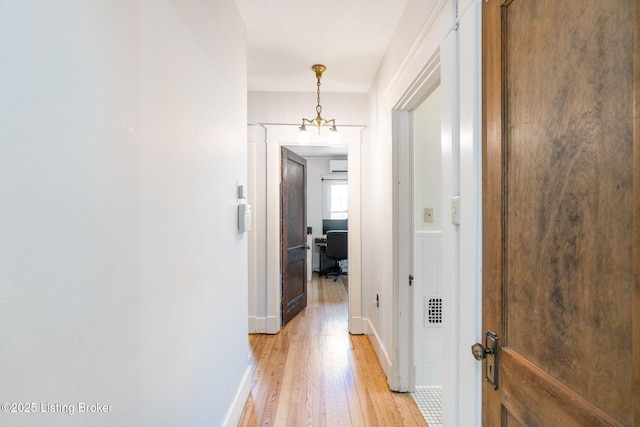 1527 Goddard Ave, Louisville, KY 40204 - hallway with light wood-style flooring, a desk, baseboards, and a wall unit AC