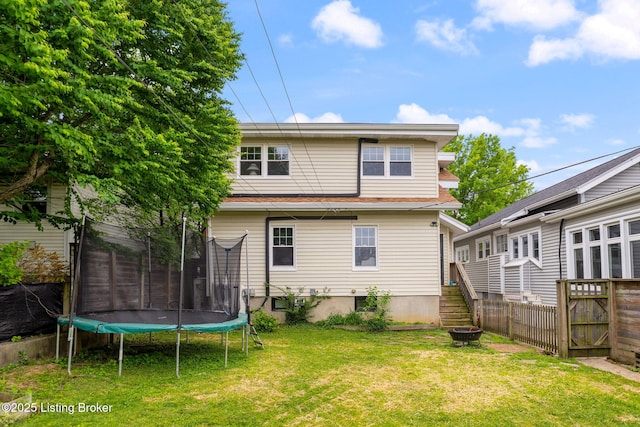 1527 Goddard Ave, Louisville, KY 40204 - rear view of house with a trampoline and a fire pit