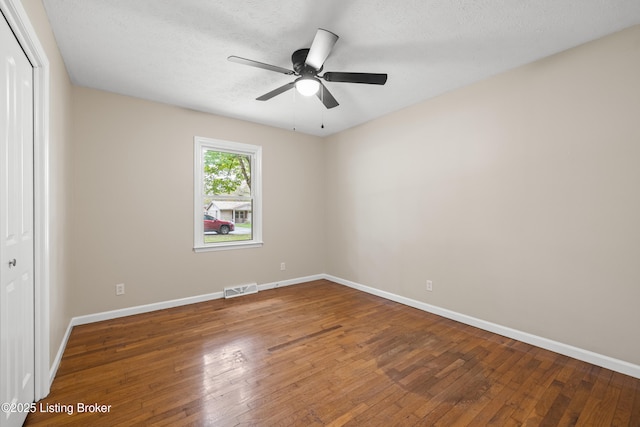 150 Joy St, Lawrenceburg, KY 40342 - unfurnished bedroom with wood-type flooring, a closet, visible vents, and baseboards