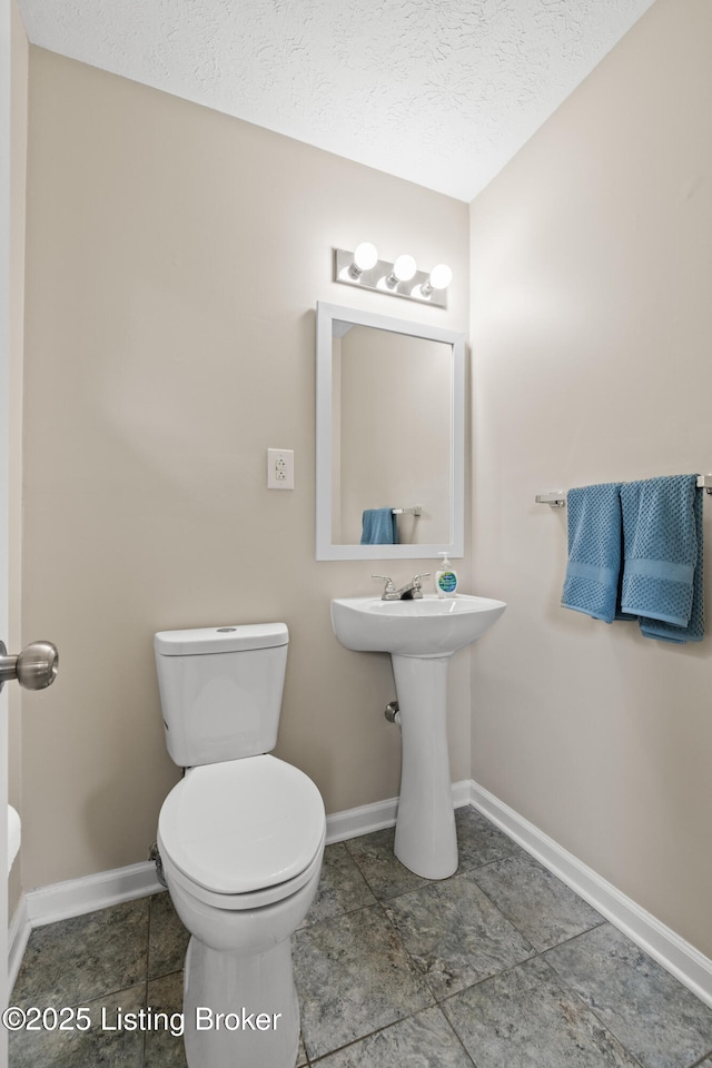 150 Joy St, Lawrenceburg, KY 40342 - bathroom featuring toilet, a textured ceiling, and baseboards