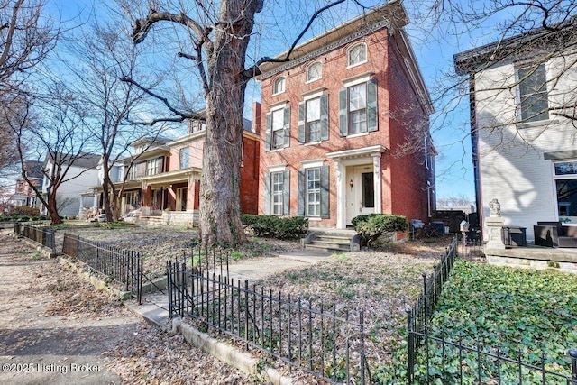 1460 S 6th St, Louisville, KY 40208 - italianate home featuring a fenced front yard and brick siding
