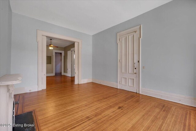 1460 S 6th St, Louisville, KY 40208 - spare room with wood finished floors, ceiling fan, and baseboards