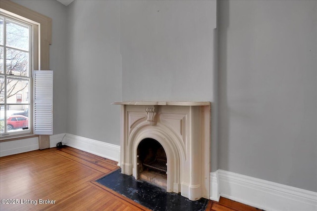 1460 S 6th St, Louisville, KY 40208 - interior details with a fireplace, wood finished floors, and baseboards
