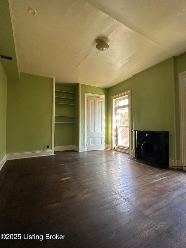 1460 S 6th St, Louisville, KY 40208 - unfurnished living room with dark wood-type flooring, visible vents, and baseboards