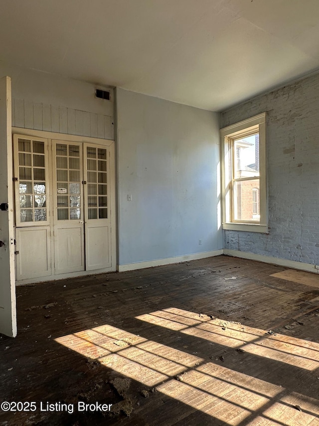 1460 S 6th St, Louisville, KY 40208 - unfurnished room with visible vents, baseboards, and dark wood-type flooring