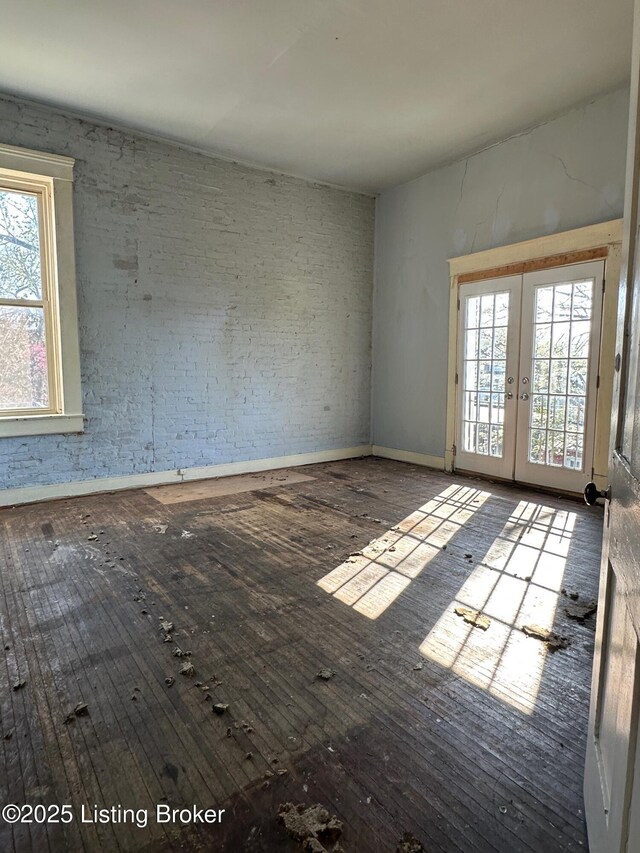 1460 S 6th St, Louisville, KY 40208 - empty room featuring french doors and hardwood / wood-style floors