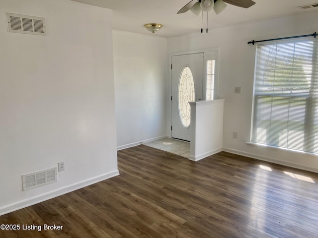 entrance foyer featuring baseboards, visible vents, and ceiling fan