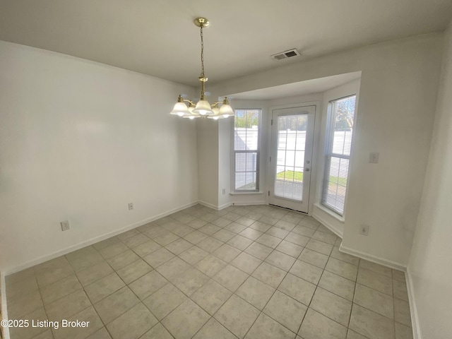 unfurnished dining area featuring baseboards, visible vents, light tile patterned floors, and an inviting chandelier