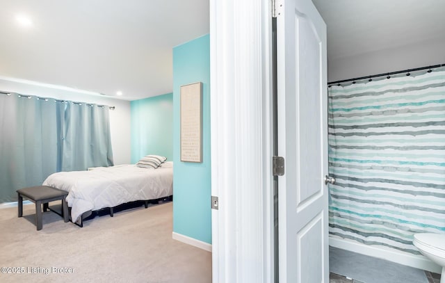 bedroom with carpet and baseboards