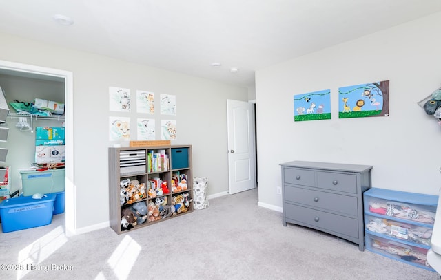 rec room featuring carpet flooring and baseboards