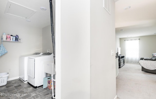 laundry room with baseboards, visible vents, washer and clothes dryer, and laundry area