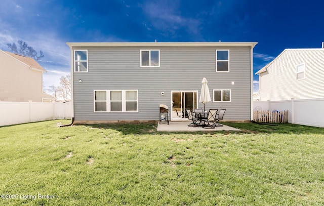 back of house with a patio, a fenced backyard, and a yard