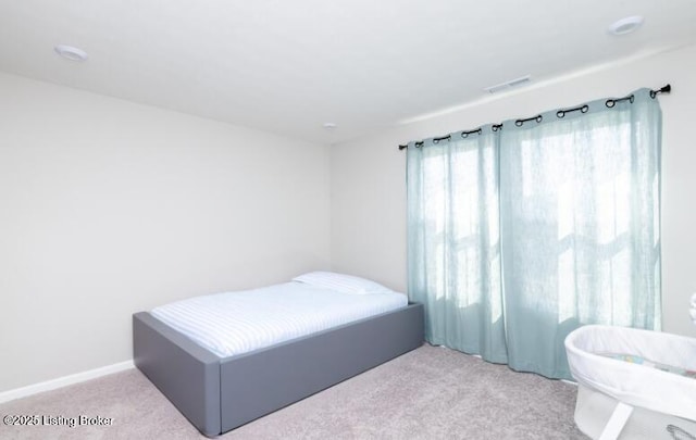 bedroom featuring visible vents and carpet flooring