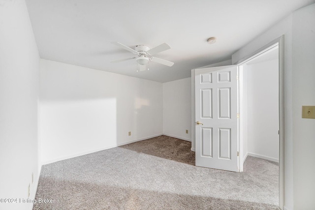 unfurnished room featuring baseboards, a ceiling fan, and carpet flooring