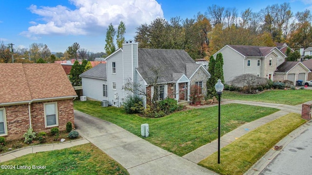 view of front facade with a chimney, brick siding, a front lawn, and a residential view