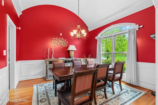 14729 Forbes Cir, Louisville, KY 40245 - dining room with light wood-style flooring, wainscoting, vaulted ceiling, a notable chandelier, and crown molding