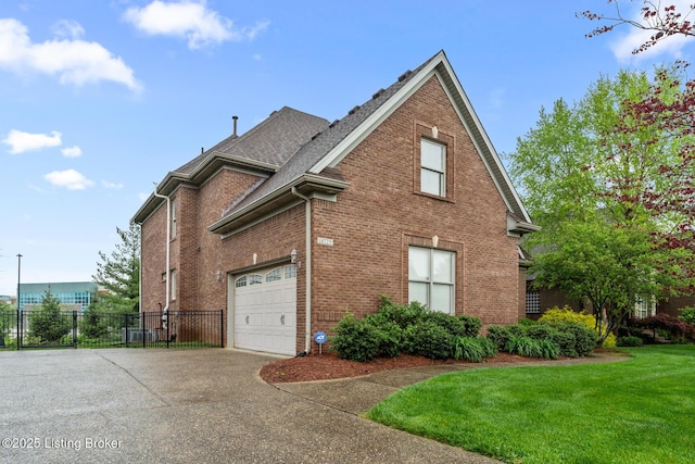 14729 Forbes Cir, Louisville, KY 40245 - view of side of property with a shingled roof, a yard, driveway, brick siding, and fence