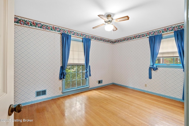 9111 Royal Oak Dr, Louisville, KY 40272 - unfurnished room with wood finished floors, a ceiling fan, and baseboards