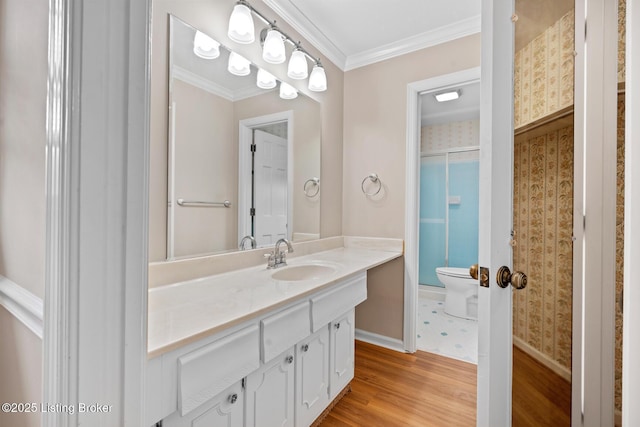 9111 Royal Oak Dr, Louisville, KY 40272 - full bathroom with toilet, vanity, wood finished floors, baseboards, and crown molding