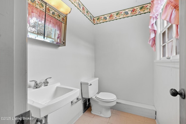 9111 Royal Oak Dr, Louisville, KY 40272 - half bathroom with toilet, a sink, and tile patterned floors