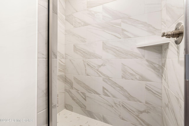 bathroom with a shower stall
