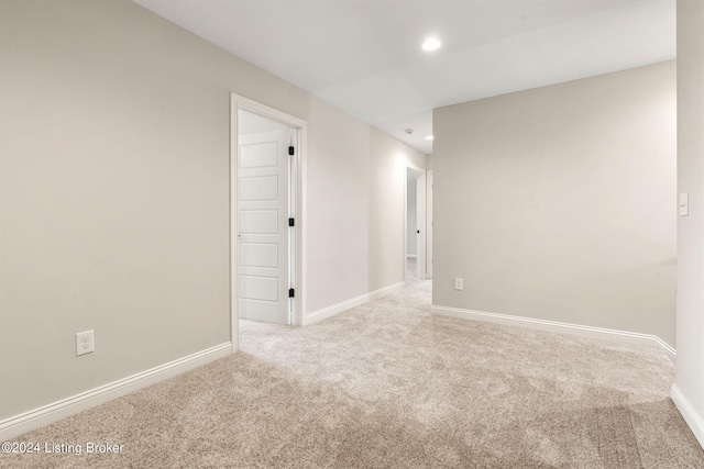 carpeted spare room with baseboards and recessed lighting