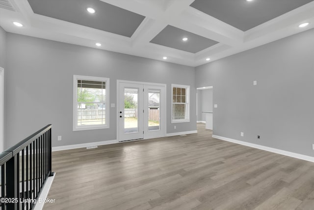 unfurnished room featuring visible vents, coffered ceiling, baseboards, light wood-type flooring, and recessed lighting